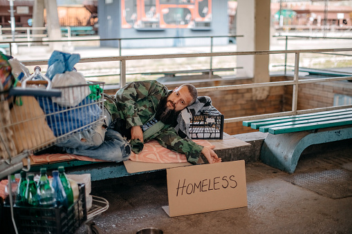 Homeless man asking for help in public