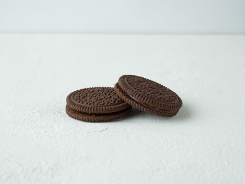 Biscuit chocolate cookies on white background.