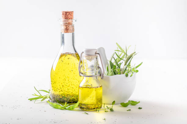 istock Healthy and fresh oil in bottle with herbs. 1422451311
