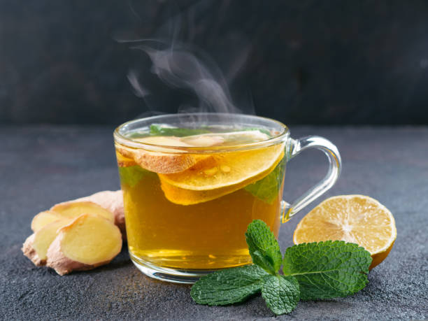 Herbal tea with ginger, mint and lemon stock photo