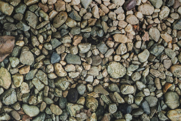 istock Top view smooth round pebble stones abstract texture background. Vacation holiday recreation on beach concept. Nature stone pebble texture concept. 1422461766