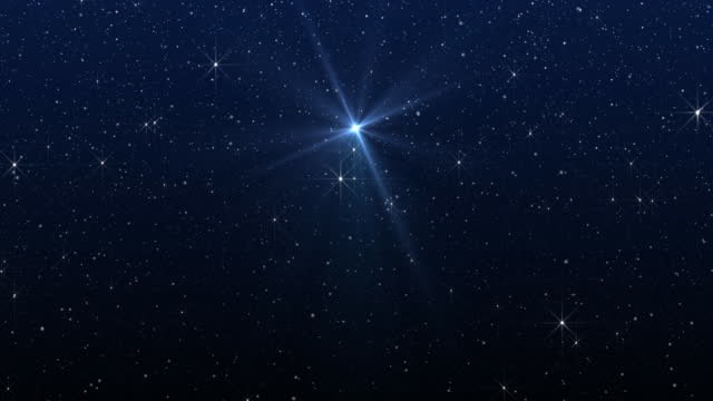 Bright star, starry sky and falling snow. Christmas background.  Christmas star of the Nativity of Bethlehem, Nativity of Jesus Christ