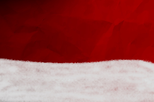 Horizontal illustration of Xmas wallpaper in dark red color. There is a wave or curved bottom made of white colored cotton like effect at the bottom border. Can be used as Christmas , New Year backdrop, poster, banner, wallpaper, gift wrapping paper sheet, templates or greeting cards.