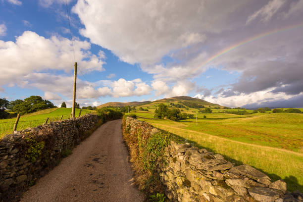 istock Rainbow over green hills in North UK. 1422468855