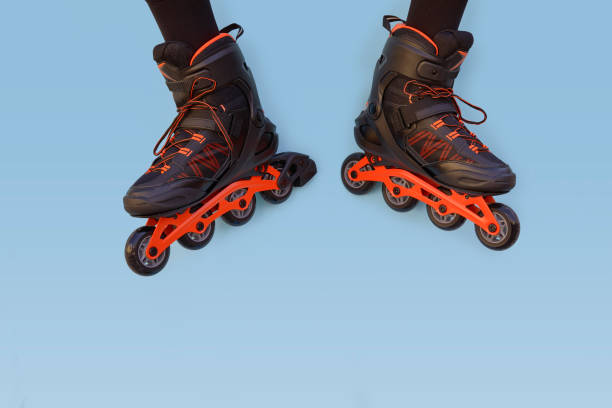 istock Two legs of a boy with inline skates facing each other 1422470027
