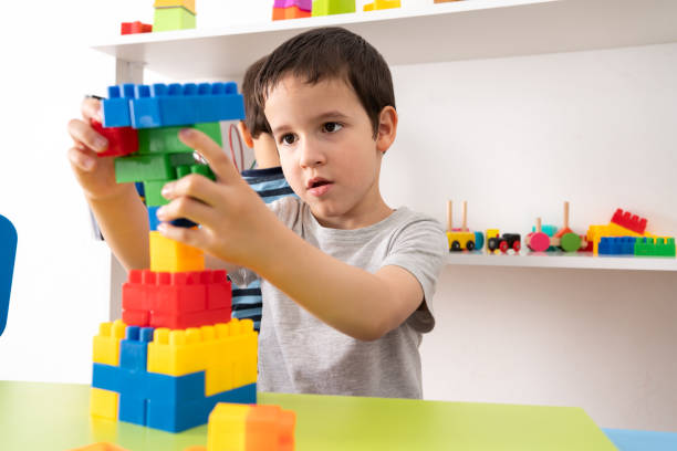istock boy playing with colourful educational toy blocks 1422473600