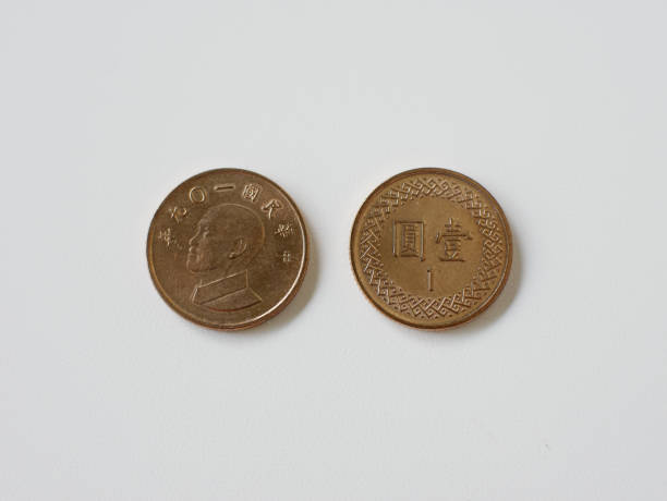 istock 1 yuan Taiwan coin close-up, isolated on a white background. 1422473650