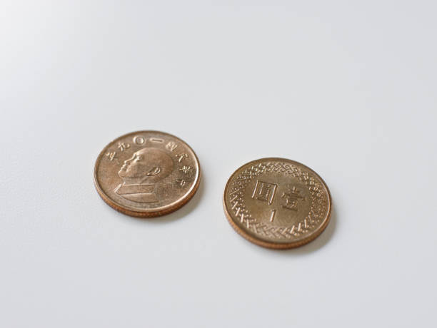 istock 1 yuan Taiwan coin close-up, isolated on a white background. 1422473735