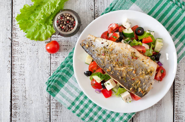 istock Baked seabass with Greek salad 1422476085
