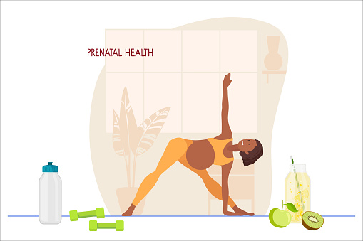 Prenatal yoga. Pregnant African American woman doing yoga in home interior. Woman in sportswear makes Triangle Pose. Women healthy life style concept. Healthy food, drinking regimen, sports