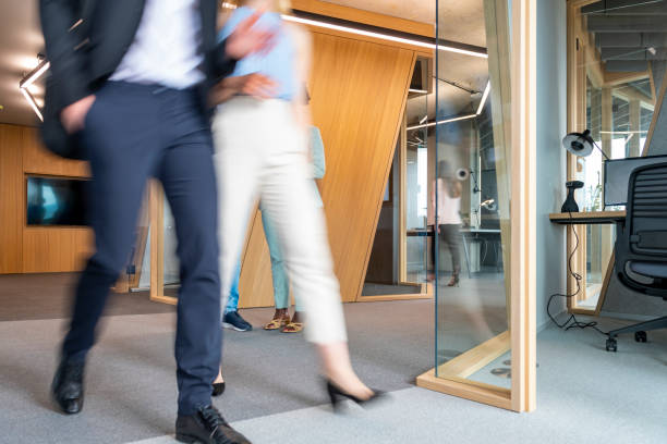 istock Business People Walking Down The Hallway 1422482112