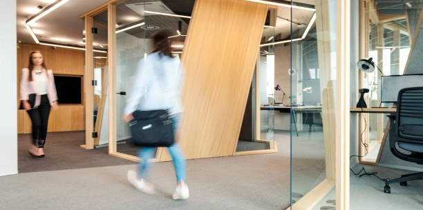 istock Business People Walking Down The Hallway 1422482118