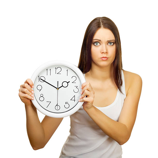 The girl with clock becomes angry The girl with clock becomes angry, on a white background clock wall clock face clock hand stock pictures, royalty-free photos & images