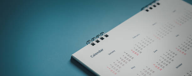 istock Embroidered red pins on a calendar event Planner calendar,clock to set timetable organize schedule,planning for business meeting or travel planning concept. 1422486757