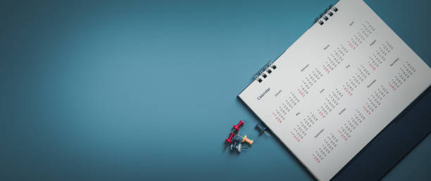 istock Embroidered red pins on a calendar event Planner calendar,clock to set timetable organize schedule,planning for business meeting or travel planning concept. 1422486758