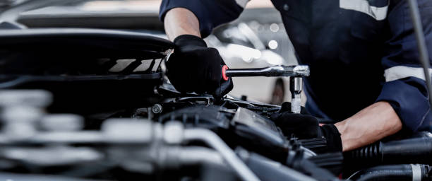istock Car care maintenance and servicing, Close-up hand technician auto mechanic using the wrench to repairing change spare part car engine problem and insurance service support. 1422486797