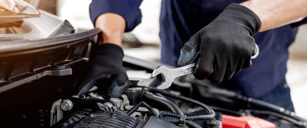 istock Car care maintenance and servicing, Close-up hand technician auto mechanic using the wrench to repairing change spare part car engine problem and insurance service support. 1422486805