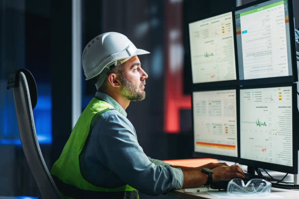 Bearded operator of factory control industry process using monitors. Engineer follow on production line Bearded operator of factory control industry process using monitors. Engineer follow on production line religious occupation stock pictures, royalty-free photos & images