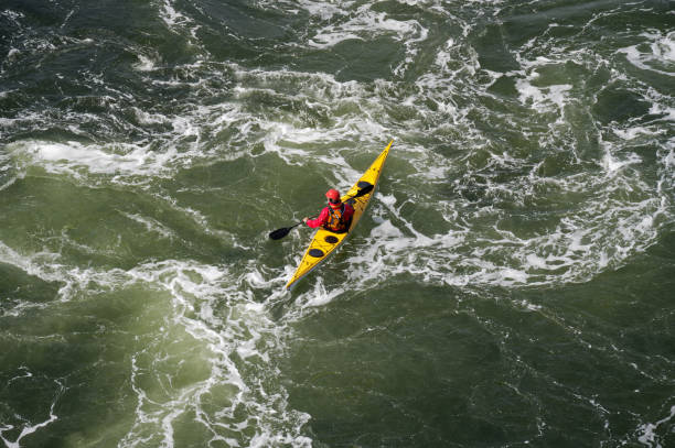 istock Blue and yellow kayak on open water at Loch Lomond 1422490366