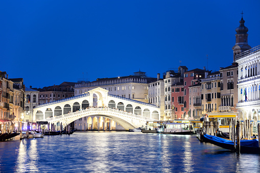 The Grand Canal and the Rialto Bridge at sunset in Venice, Italy