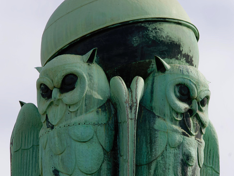 Statue of owls on a rooftop of a Croatian State Archives building in Zagreb, Croatia