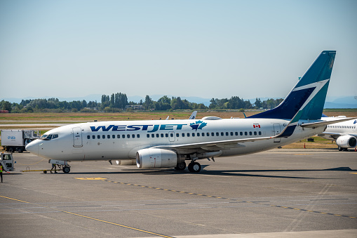 Vancouver, British Columbia - July 31, 2022: Westjet aircraft on the tarmac of Vancouver's international airport.