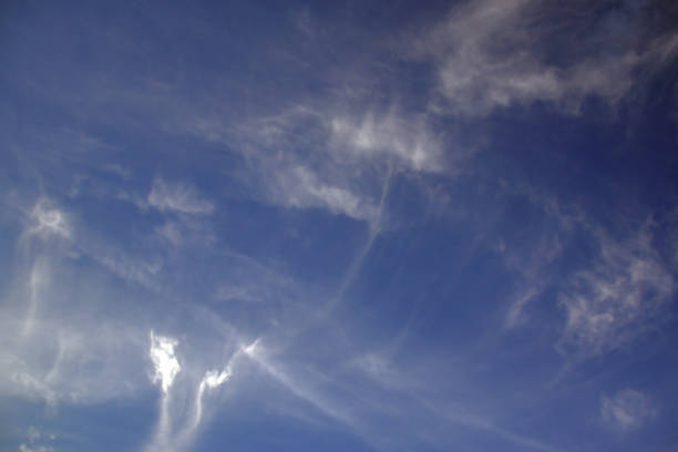 istock Light white translucent cirrus clouds in the blue sky. 1422515231