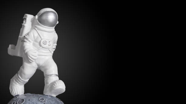istock Plastic toy figure astronaut on a dark background with copy space. World Space Week 2022. Space and Sustainability. Close-up. 1422516175