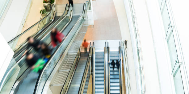 istock People in escalators at the modern shopping mall 1422516794