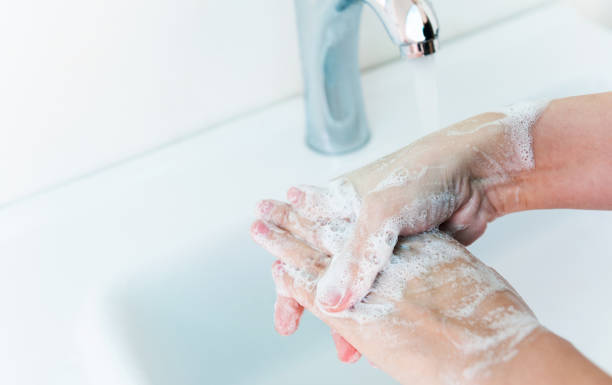 istock Washing hands with soap under running water 1422519286