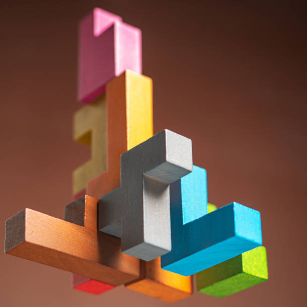 istock Abstract construction from wooden blocks. The concept of logical thinking. 1422520105