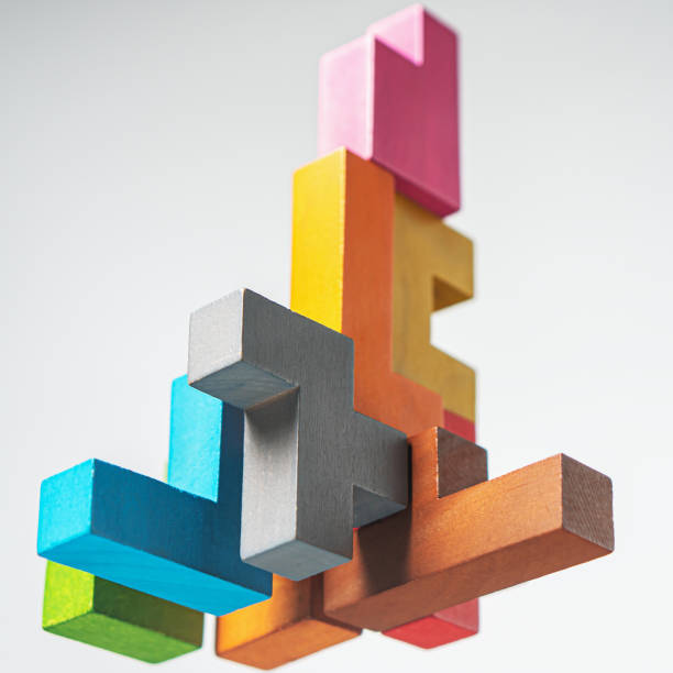 istock Abstract construction from wooden blocks. The concept of logical thinking. 1422520110