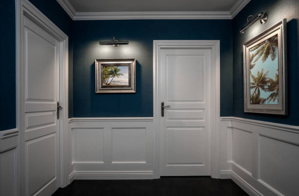 Empty elegant hallway Empty hallway with elegant wooden moulding panels and pictures on the wall moulding door jamb wood stock pictures, royalty-free photos & images