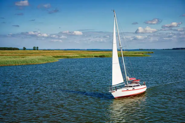 Sailing boat on the Zingster Strom river, Fischland-Darß Peninsula, Mecklenburg-West Pomerania, Germany