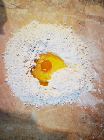 dough with flour and egg. add the flour and eggs and start kneading