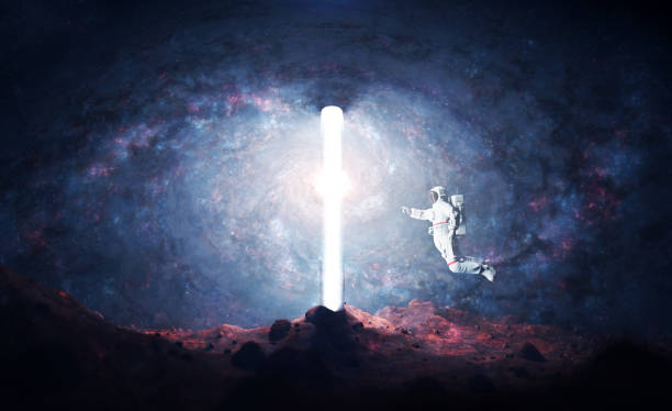 istock Astronaut on alien planet entering spacetime portal light 1422527547