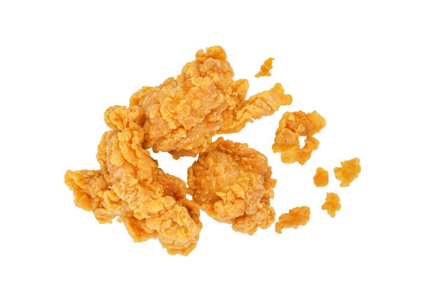 istock Fried popcorn chicken with crumbs isolated on white 1422529824