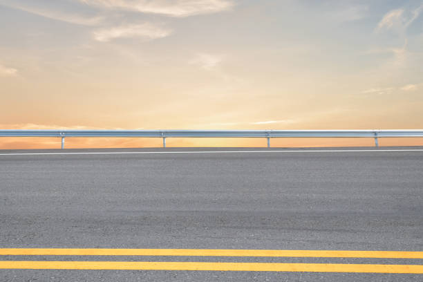 istock Side view of asphalt road with sunset sky background 1422529833