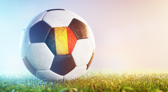 Football soccer ball with flag of Belgium on grass. Belgian national team