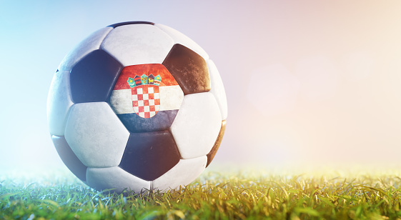 Football soccer ball with flag of Croatia on grass. Croatian national team
