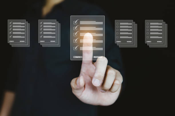 istock Hand pressing virtual screen and touch document for online approve paperless quality assurance and management report concept. 1422530912