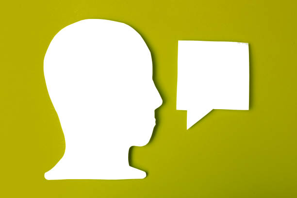 istock paper face and speech bubble on colorbackground copy space for text, communication, symbolic 1422532326