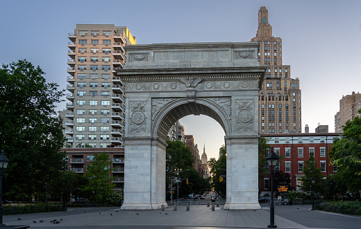 The  Washington Square Arch During Sunrise with 5th ave and the Empire State Buidling in the background