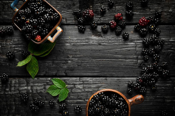 Blakberries on wooden table. Top view
