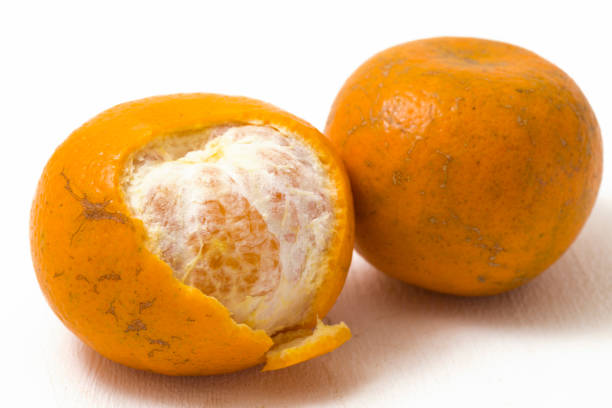 istock Fresh peeled mandarin orange on white background 1422542003