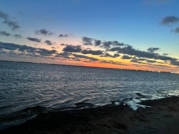 istock Waves in the bays and the sunset sky 1422543433