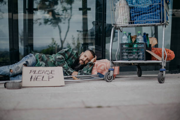 Homeless man in the city stock photo
