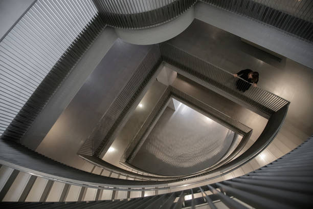 istock Overhead shot of grey spiral staircase 1422546442