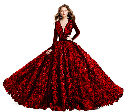 Fashion Model in Red Evening Dress. Beautiful Woman in Princess Ball Gown and Curly Hairstyle. Elegant Lady in Luxury Wedding Dress with Rose Flower over White Isolated Studio Background