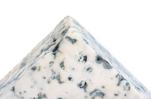 Wedge of blue cheese isolated on white